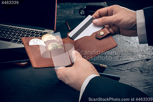 Image of The golden bitcoin in mail hands