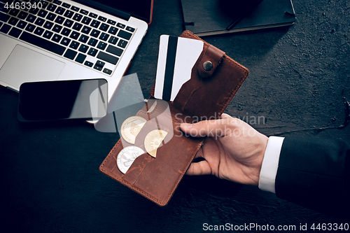 Image of The golden bitcoin in mail hands