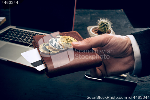 Image of The golden bitcoin in mail hands