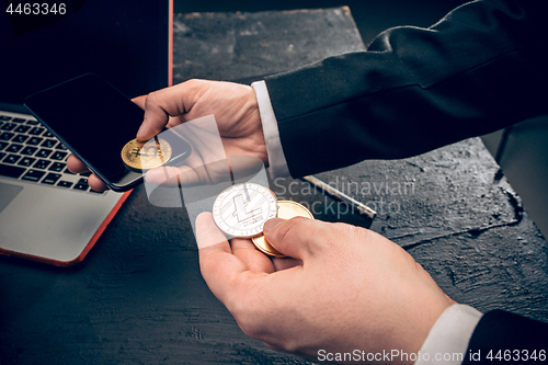 Image of The golden bitcoin in mail hands