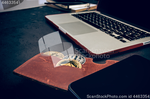 Image of The golden bitcoin, phone, keyboard