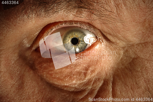 Image of Close-up view on the eye of senior man.