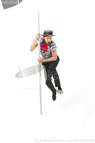 Image of Caucasian man in traditional gondolier costume and hat