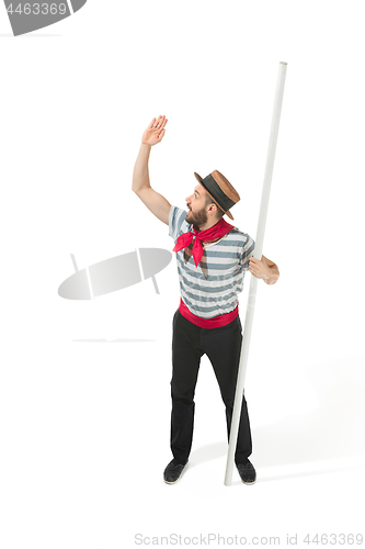 Image of Caucasian man in traditional gondolier costume and hat