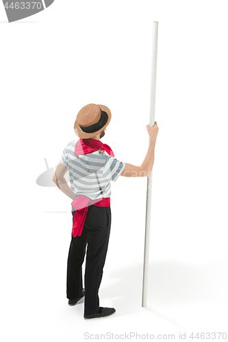 Image of Caucasian man in traditional gondolier costume and hat