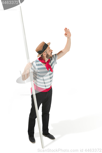 Image of Caucasian man in traditional gondolier costume and hat