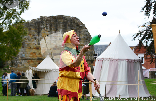 Image of Bosco the Jester juggles objects at a Medieval Fair