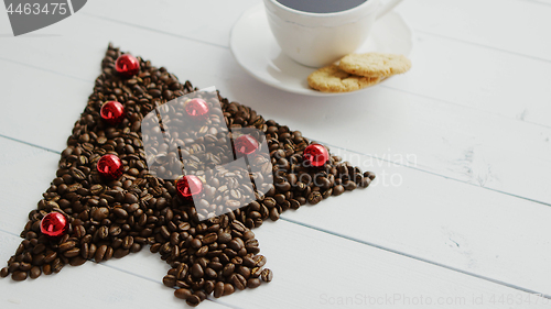 Image of Coffee beans in shape of conifer and cup