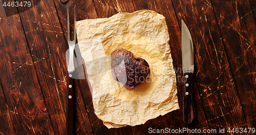 Image of Piece of meat on napkin