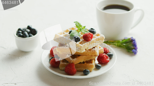 Image of Waffles on plate and cup of coffee