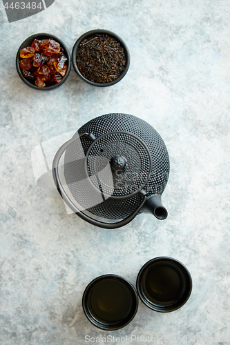 Image of Traditional eastern metal teapot and iron cups