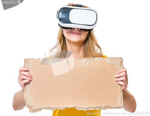 Image of Woman looking in VR glasses