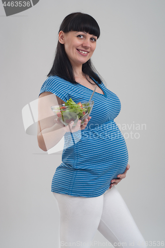 Image of Pregnant woman on gray
