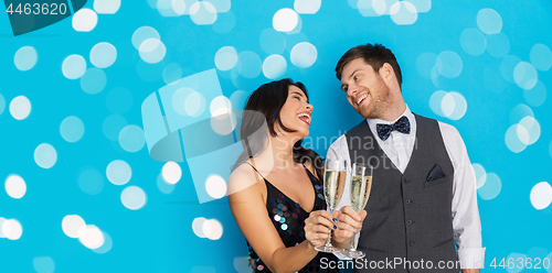 Image of happy couple with champagne glasses at party