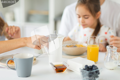 Image of close up of family having breakfast at home