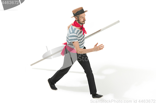 Image of Caucasian man in traditional gondolier costume and hat