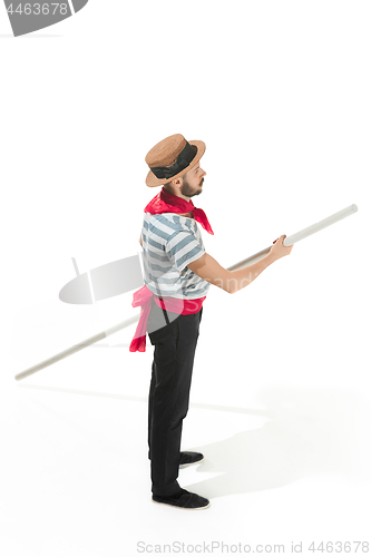 Image of Caucasian man in traditional gondolier costume and hat