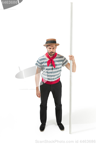 Image of Caucasian man in traditional gondolier costume and hat