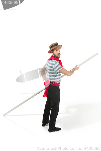 Image of Caucasian man in traditional gondolier costume and hat