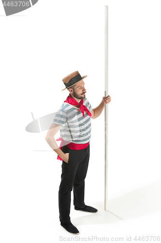 Image of Caucasian man in traditional gondolier costume and hat