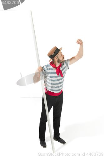 Image of Caucasian man in traditional gondolier costume and hat