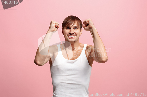 Image of Winning success man happy ecstatic celebrating being a winner. Dynamic energetic image of male model