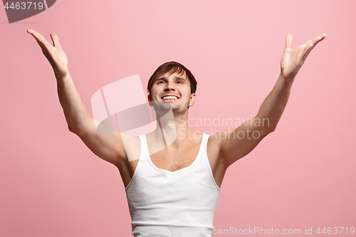 Image of Winning success man happy ecstatic celebrating being a winner. Dynamic energetic image of male model