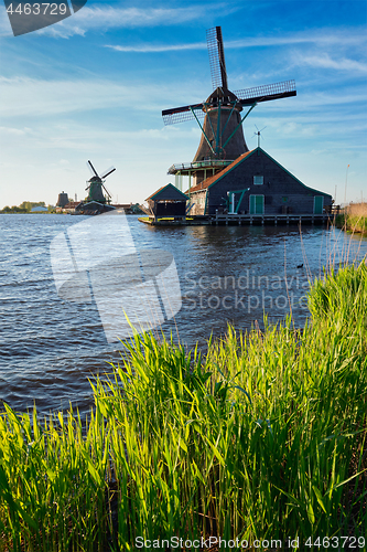 Image of Windmills at Zaanse Schans in Holland on sunset. Zaandam, Nether