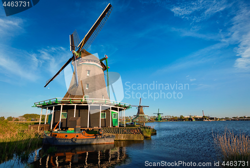 Image of Windmills at Zaanse Schans in Holland on sunset. Zaandam, Nether