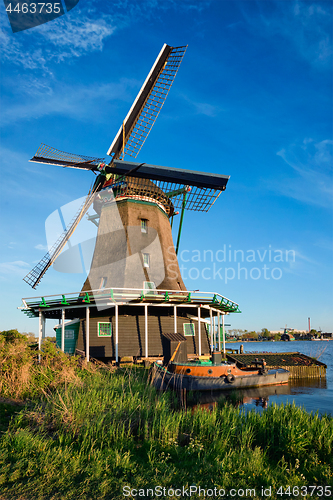 Image of Windmills at Zaanse Schans in Holland on sunset. Zaandam, Nether