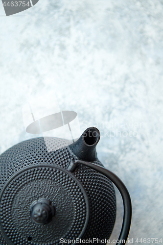 Image of Black metal oriental teapot isolated