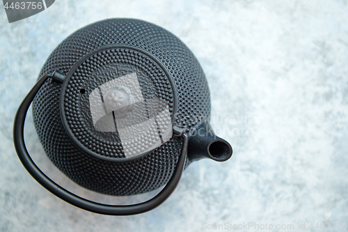 Image of Black metal oriental teapot isolated