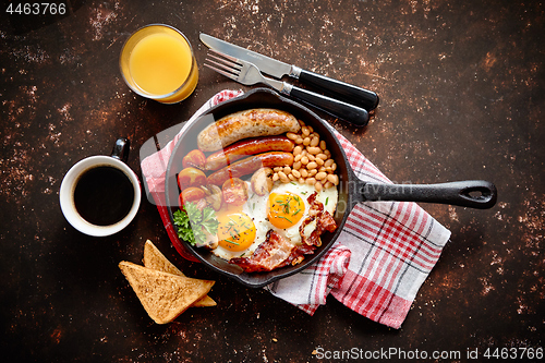 Image of Delicious english breakfast in iron cooking pan