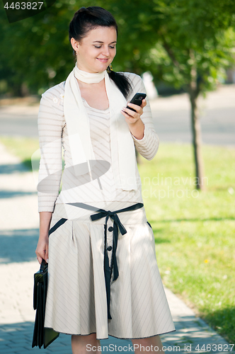 Image of Business young woman in park