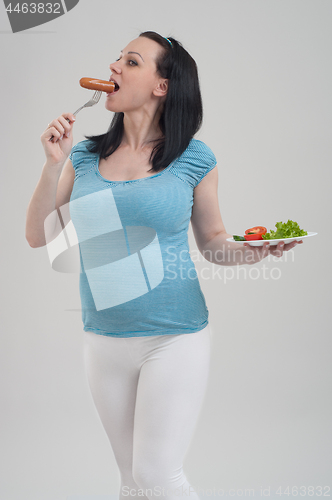 Image of Pregnant woman on gray