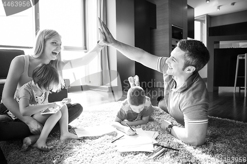 Image of young couple spending time with kids