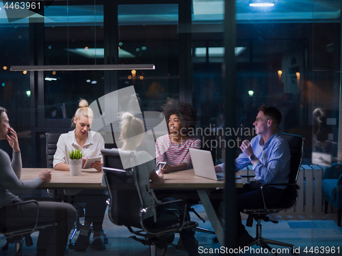 Image of Multiethnic startup business team in night office