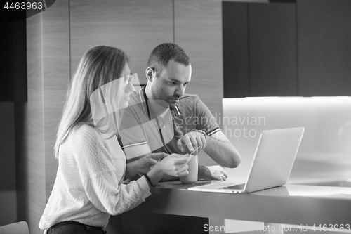 Image of happy young couple buying online