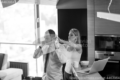 Image of A young couple is preparing for a job and using a laptop