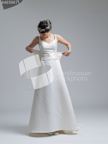 Image of Portrait of beautiful young women in wedding dress