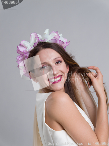 Image of young bride in a wedding dress with a veil