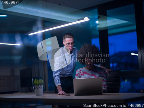 Image of Multiethnic startup business team in night office