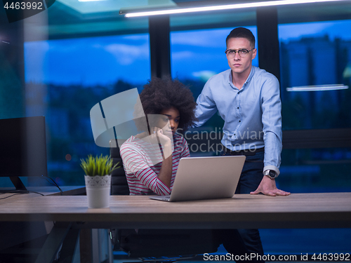 Image of Multiethnic startup business team in night office