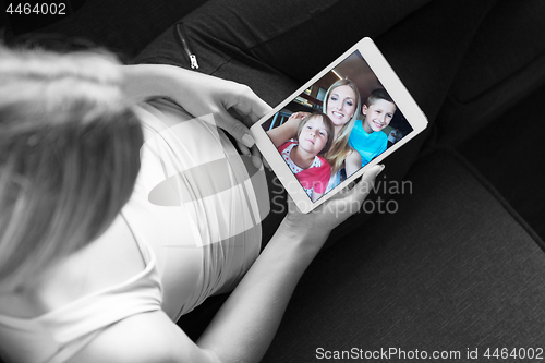 Image of woman using tablet in beautiful apartment