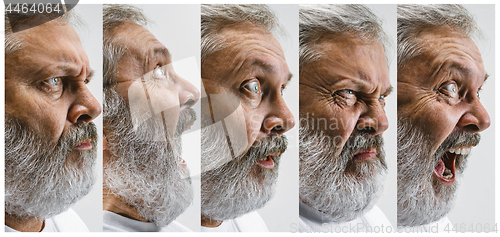 Image of The senior attractive man looking suprised isolated on white