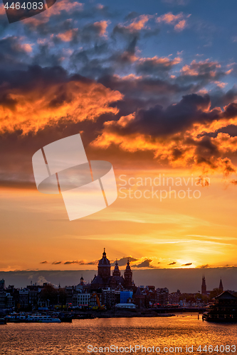 Image of Amsterdam cityscape skyline with  Church of Saint Nicholas on su