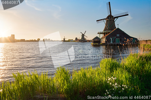 Image of Windmills at Zaanse Schans in Holland on sunset. Zaandam, Nether