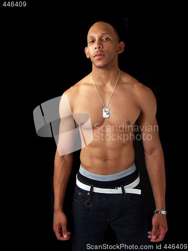 Image of Young black man in jeans and bare top