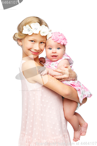 Image of happy beautiful girl with baby baby sister