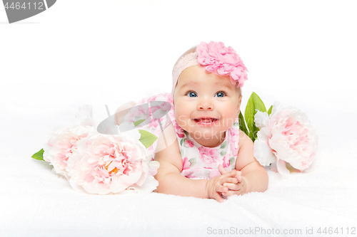 Image of happy beautiful baby girl with flower on head